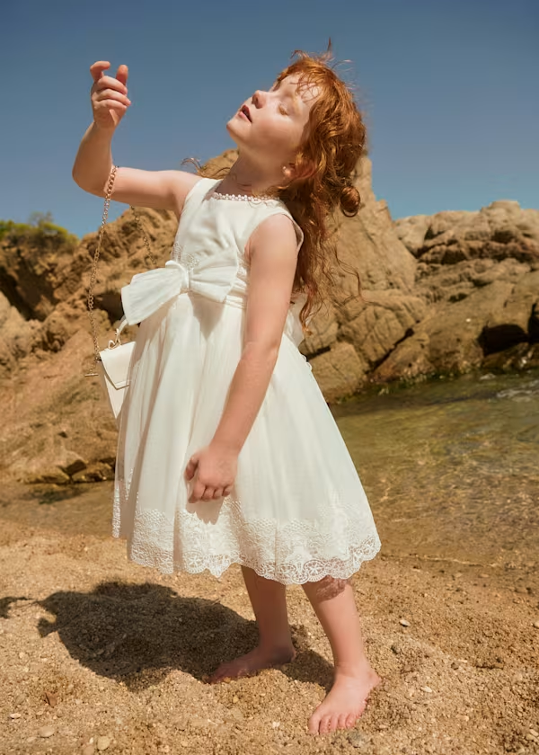 Abito tulle traforato con fiocco