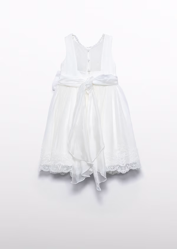 Abito tulle traforato con fiocco